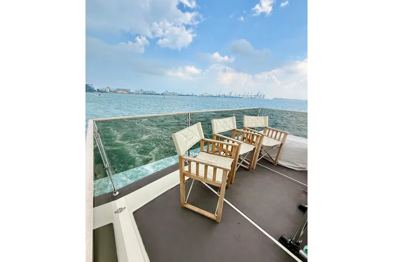 Slide: The Image of Deck view of 2007 Azimut 68E yacht with chairs overlooking the ocean. - 79