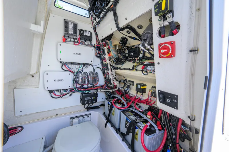 Slide: The Image of 2024 Sportsman Open 232 Center Console electrical system with wiring and components. - 54