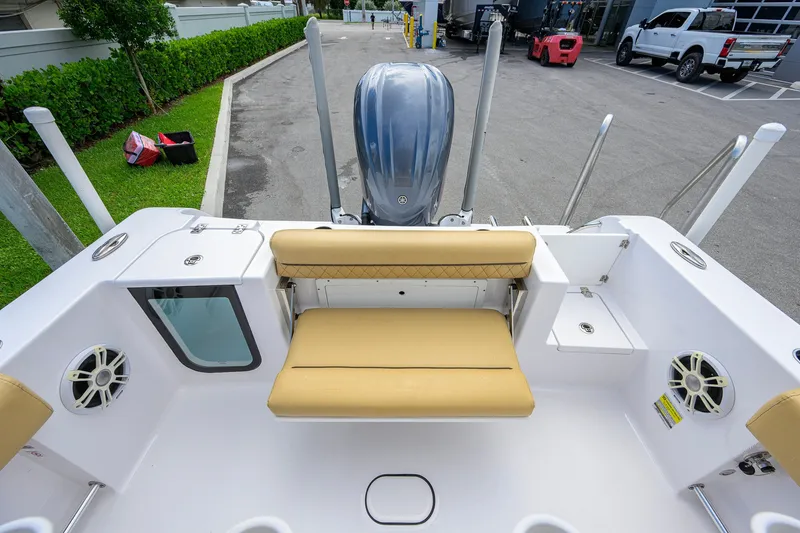 Slide: The Image of 2024 Sportsman Open 232 Center Console boat with tan seating and modern design. - 43