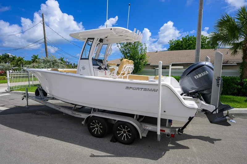 Slide: The Image of 2024 Sportsman Open 232 Center Console boat on trailer, featuring Yamaha engine. - 9