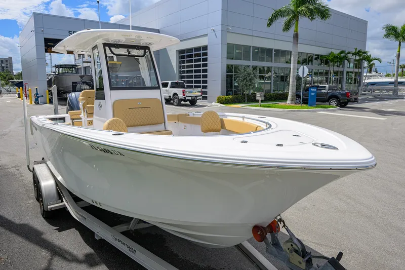 Slide: The Image of 2024 Sportsman Open 232 Center Console boat on trailer, parked outside dealership. - 8
