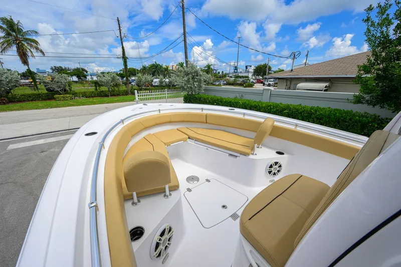 Slide: The Image of 2024 Sportsman Open 232 Center Console boat with tan seating and spacious deck. - 23