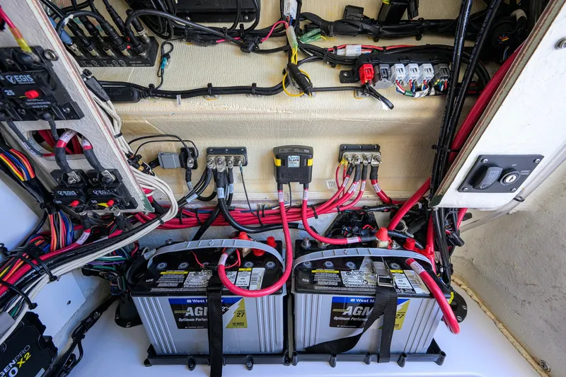Slide: The Image of 2024 Sportsman Open 232 Center Console electrical system with AGM batteries and wiring. - 55