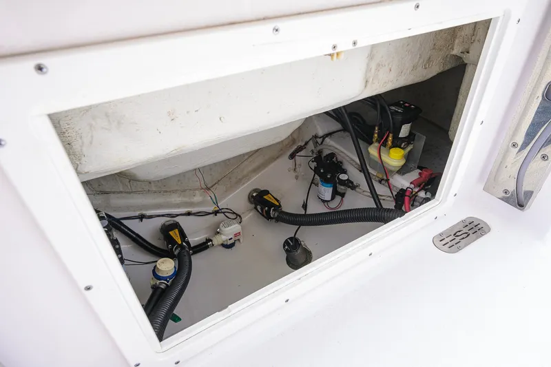 Slide: The Image of 2024 Sportsman Open 232 Center Console boat interior wiring and components. - 47