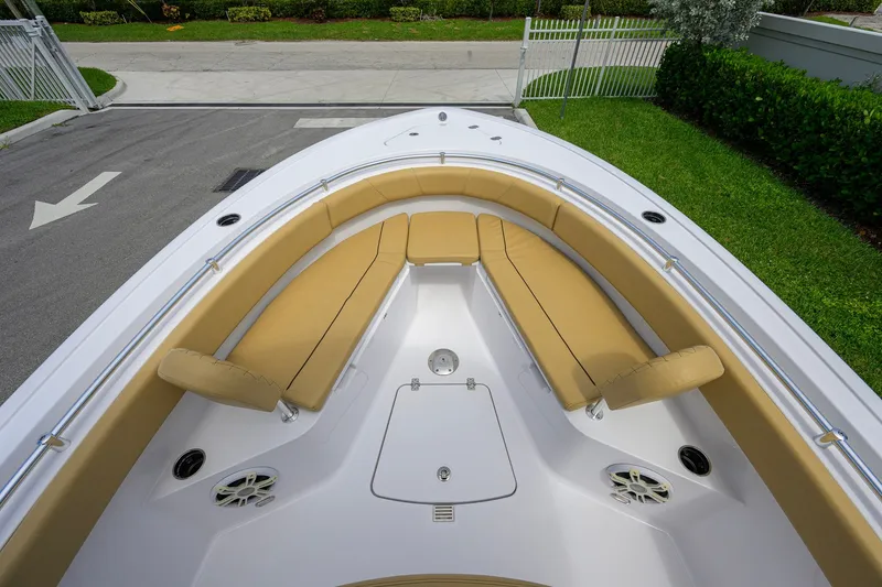 Slide: The Image of 2024 Sportsman Open 232 Center Console boat with tan seating and sleek design. - 20