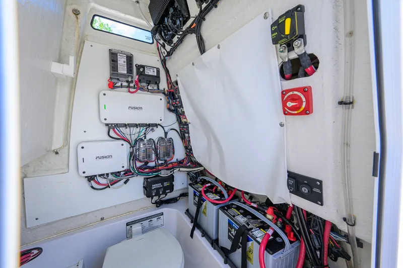Slide: The Image of 2024 Sportsman Open 232 Center Console electrical system with wiring and battery setup. - 53