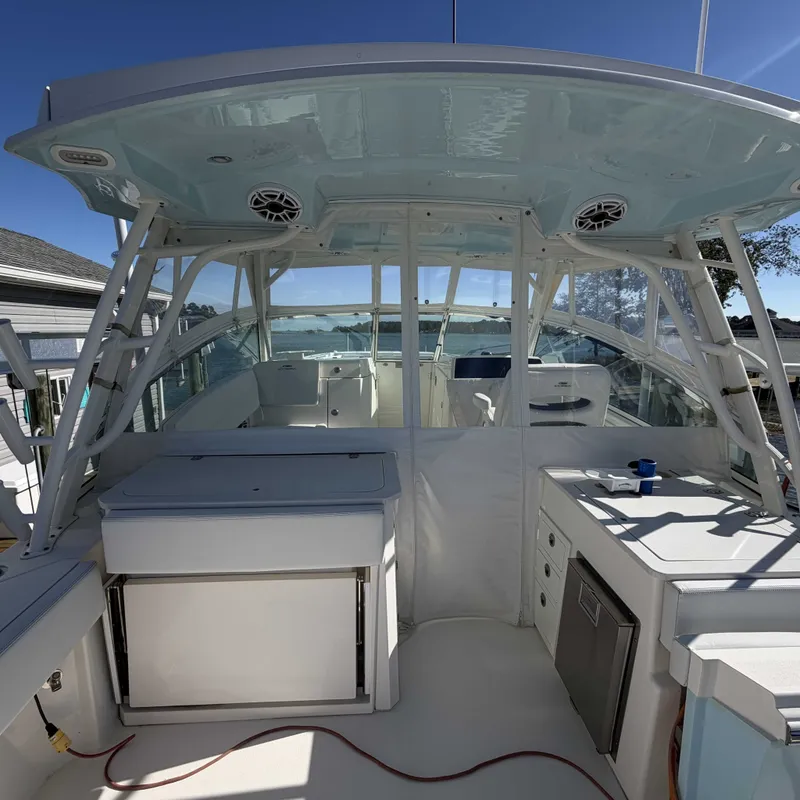 Slide: The Image of The image shows the cockpit of a 2023 Cobia 330 Dual Console boat with modern features. - 5