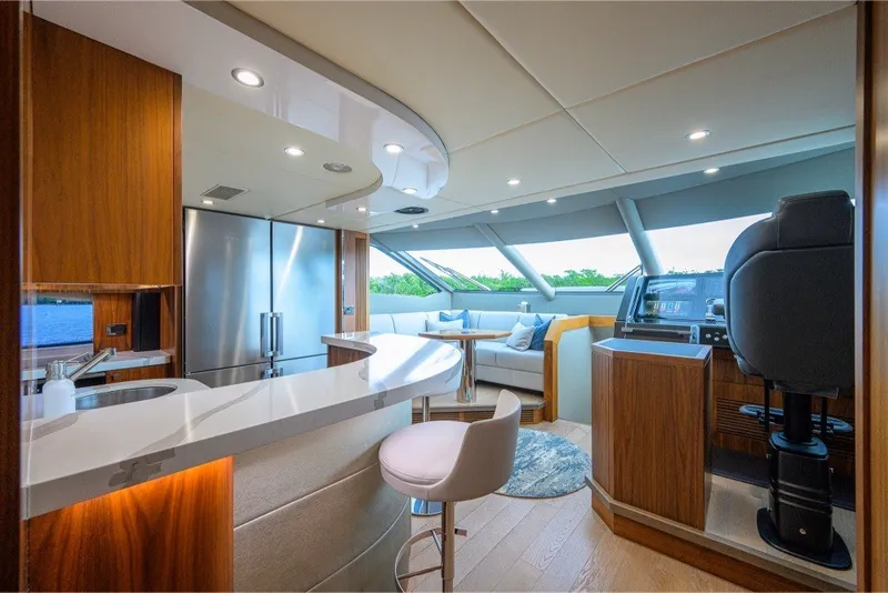 Slide: The Image of Luxurious interior of 2018 Sunseeker 86 Yacht with modern kitchen and seating area. - 23