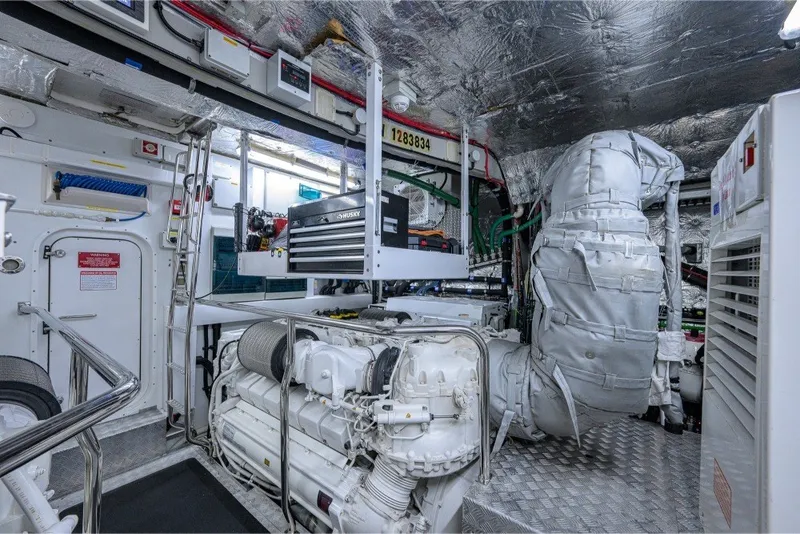 Slide: The Image of Engine room of 2018 Sunseeker 86 Yacht, featuring advanced machinery and equipment. - 74