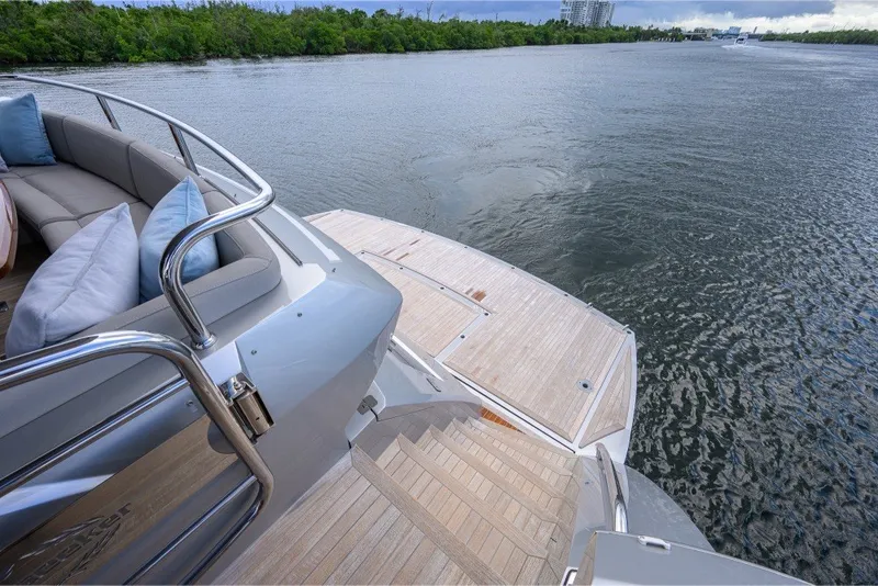 Slide: The Image of Luxurious 2018 Sunseeker 86 Yacht with elegant deck and scenic water view. - 8