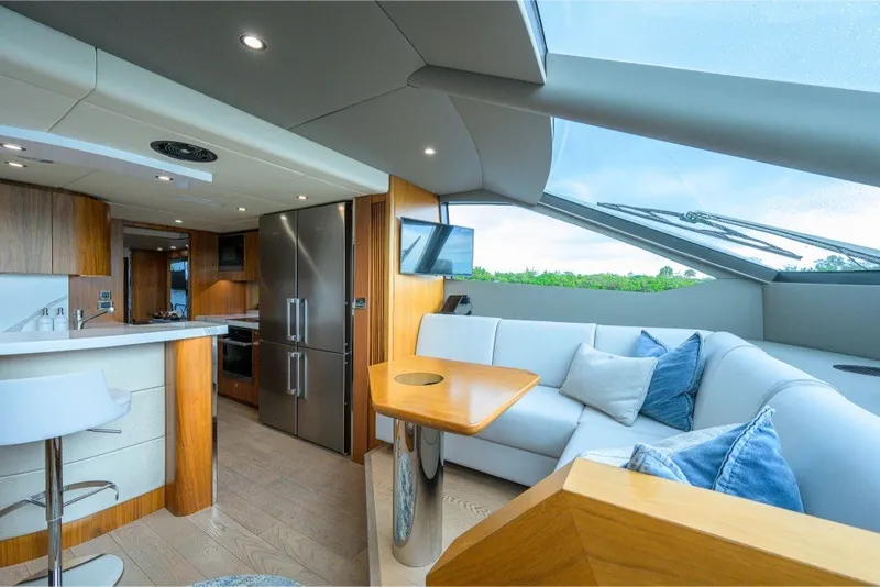 Slide: The Image of Luxurious interior of 2018 Sunseeker 86 Yacht with modern kitchen and seating area. - 22