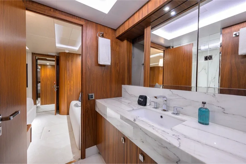 Slide: The Image of Luxurious bathroom interior of 2018 Sunseeker 86 Yacht with marble sink and wooden accents. - 38