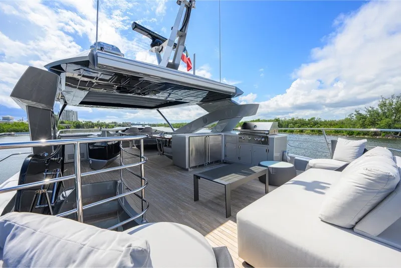 Slide: The Image of Luxurious 2018 Sunseeker 86 Yacht deck with modern seating and scenic water views. - 57