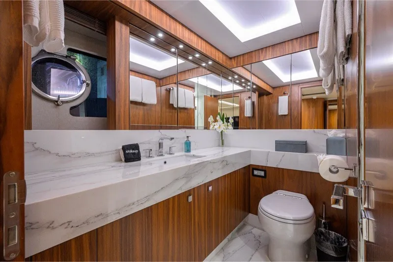 Slide: The Image of Luxurious bathroom on 2018 Sunseeker 86 Yacht with marble countertop and wood accents. - 36