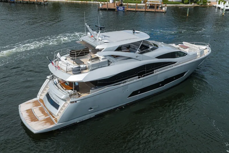 Slide: The Image of 2018 Sunseeker 86 Yacht cruising on calm waters, showcasing sleek design and luxury features. - 4