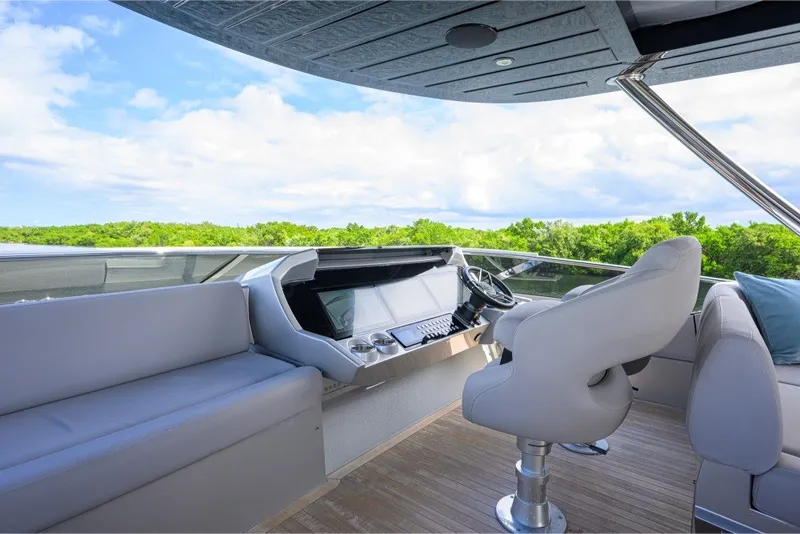 Slide: The Image of Luxurious helm of 2018 Sunseeker 86 Yacht with modern seating and controls. - 66