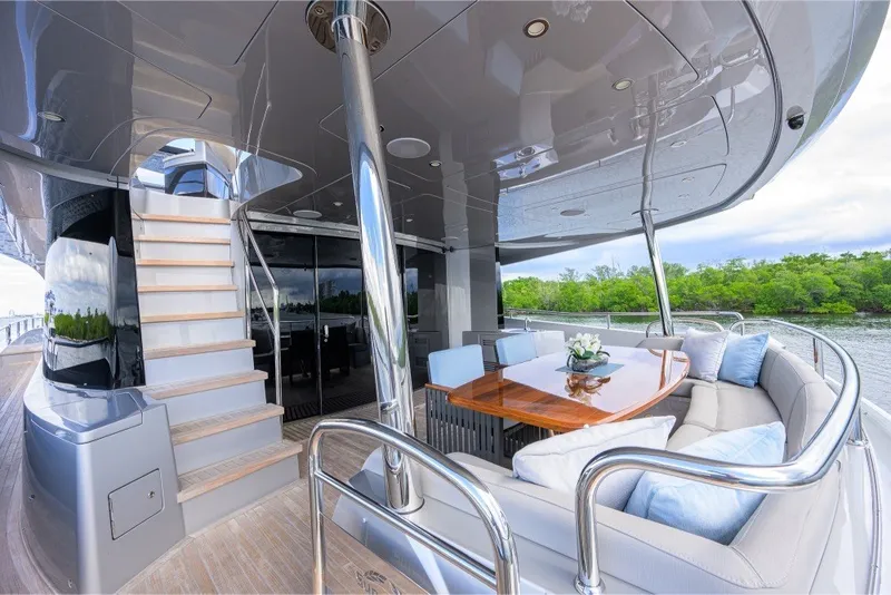 Slide: The Image of Luxurious 2018 Sunseeker 86 Yacht deck with elegant seating and dining area. - 12