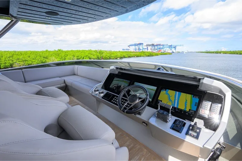 Slide: The Image of Luxurious 2018 Sunseeker 86 Yacht helm with modern navigation system and plush seating. - 67