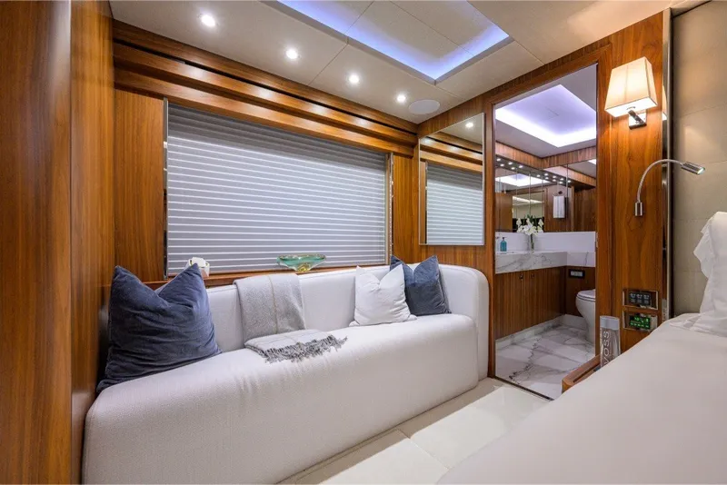 Slide: The Image of Luxurious interior of 2018 Sunseeker 86 Yacht with elegant wood paneling and plush seating. - 32