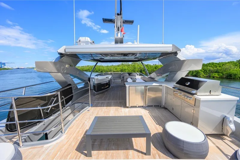 Slide: The Image of Luxurious 2018 Sunseeker 86 Yacht deck with outdoor kitchen and seating area. - 58