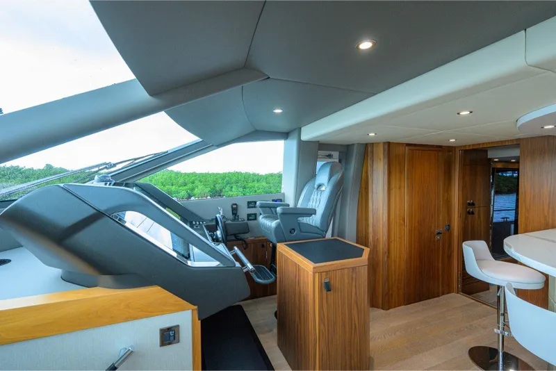 Slide: The Image of Luxurious interior of 2018 Sunseeker 86 Yacht with modern helm and seating area. - 28