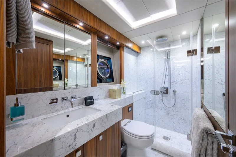 Slide: The Image of Luxurious bathroom on 2018 Sunseeker 86 Yacht with marble and wood finishes. - 47