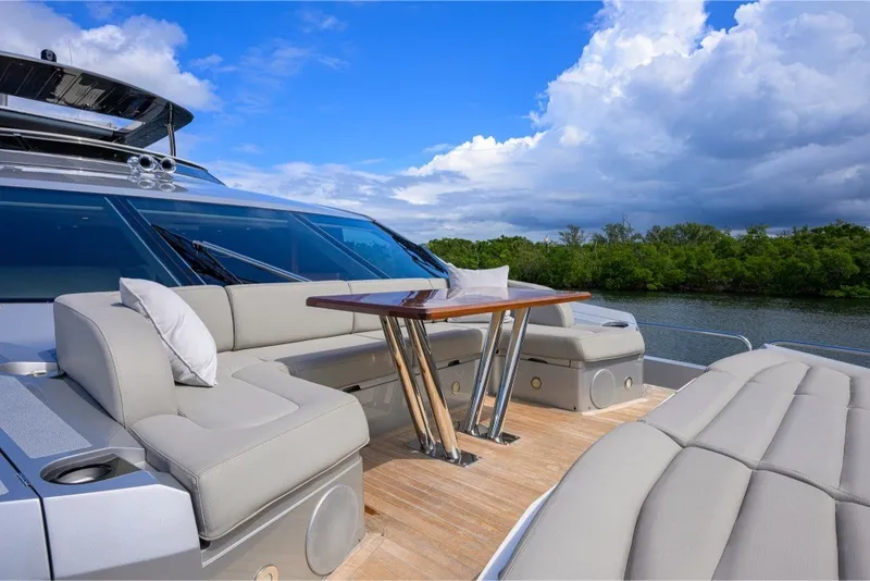 Slide: The Image of Luxurious 2018 Sunseeker 86 Yacht deck with elegant seating and scenic water view. - 71