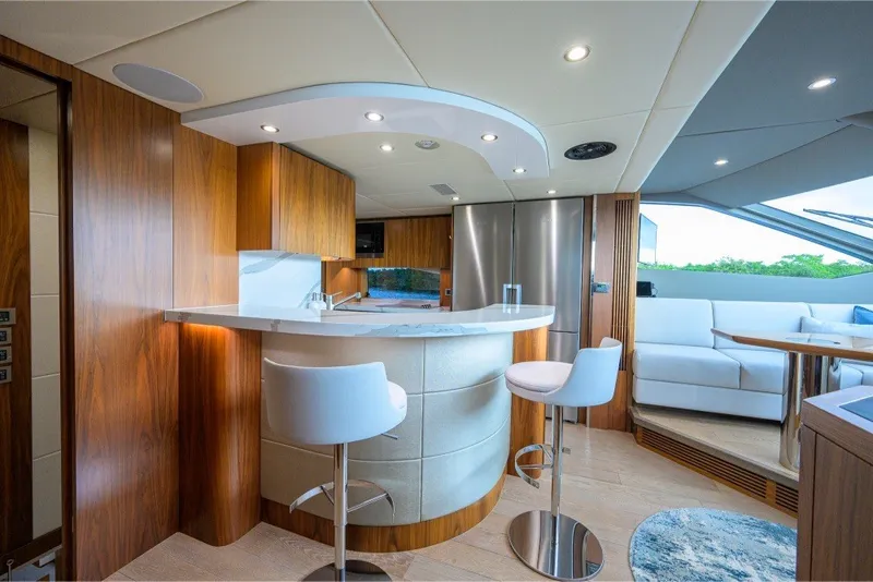 Slide: The Image of Luxurious interior of 2018 Sunseeker 86 Yacht with modern kitchen and seating area. - 24