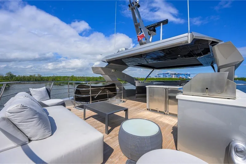 Slide: The Image of Luxurious Sunseeker 86 Yacht 2018 deck with modern seating and scenic water view. - 59