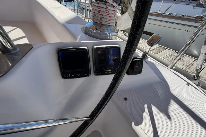 Slide: The Image of Cockpit of 2014 Catalina 445 sailboat with navigation instruments and steering wheel. - 20
