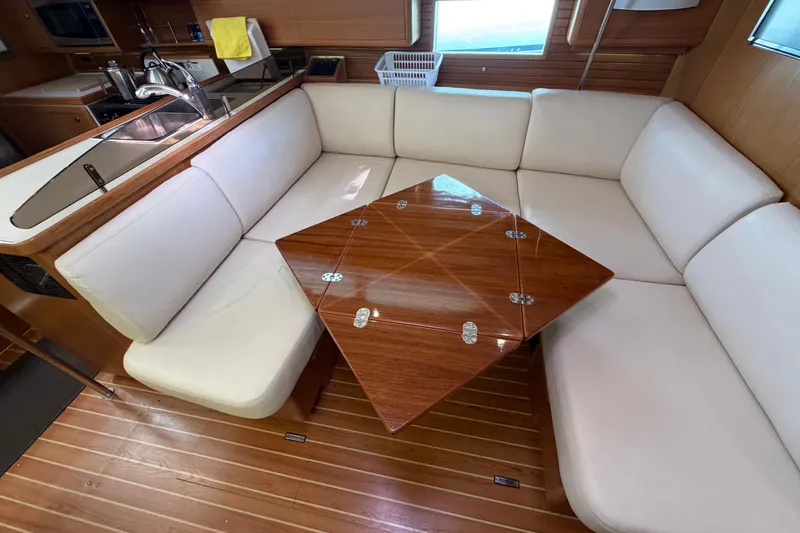 Slide: The Image of Luxurious interior of 2014 Catalina 445 yacht with elegant seating and wooden table. - 44