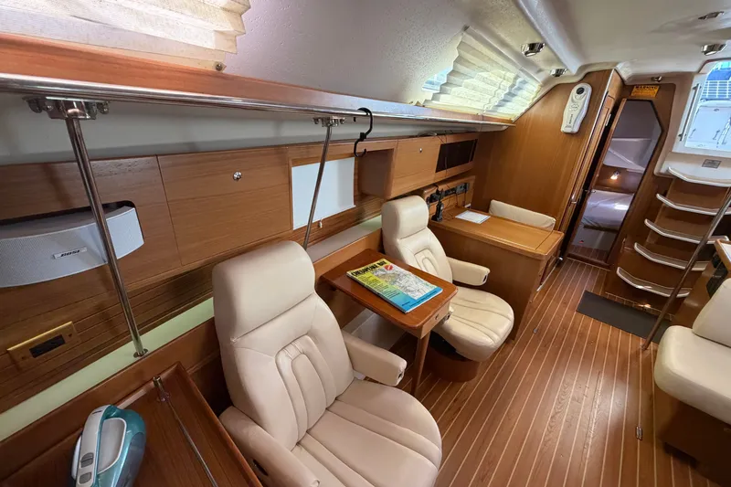 Slide: The Image of Luxurious interior of a 2014 Catalina 445 yacht with plush seating and wooden finishes. - 41