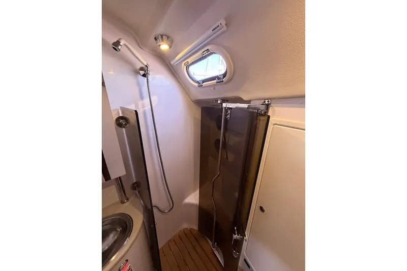 Slide: The Image of Shower area in 2014 Catalina 445 yacht with modern fixtures and wooden flooring. - 60