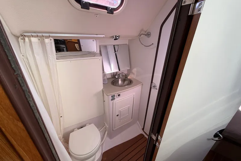 Slide: The Image of Compact bathroom in a 2014 Catalina 445 yacht with sink, toilet, and shower. - 47