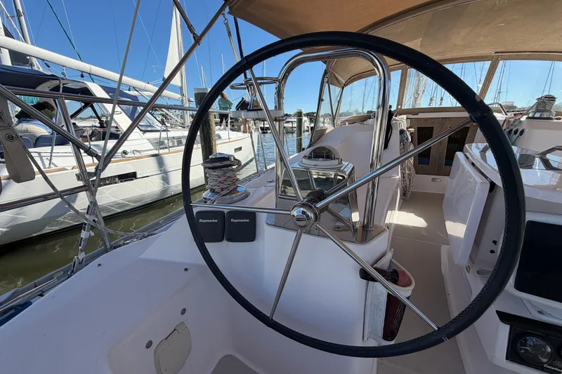 Slide: The Image of Steering wheel of a 2014 Catalina 445 sailboat docked at a marina. - 23