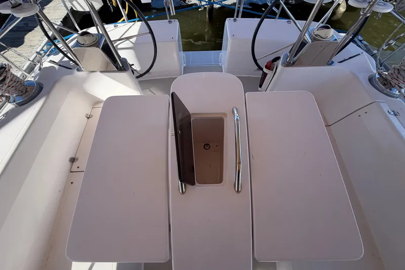 Slide: The Image of Cockpit view of a 2014 Catalina 445 sailboat with seating and storage compartments. - 17