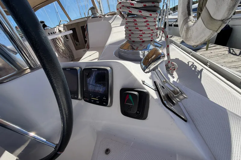 Slide: The Image of Cockpit view of a 2014 Catalina 445 sailboat with navigation instruments and winch. - 21