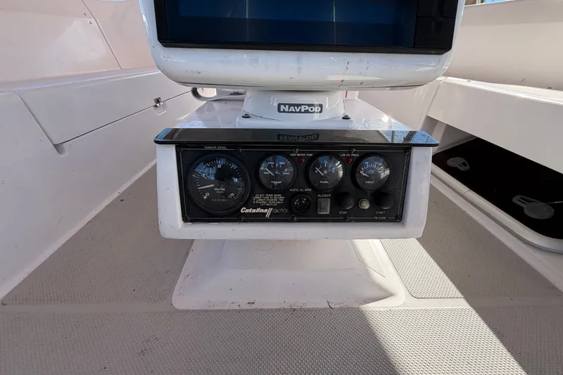 Slide: The Image of Control panel of a 2014 Catalina 445 sailboat with gauges and NavPod display. - 19