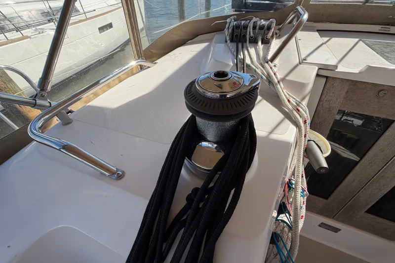 Slide: The Image of Sailboat deck of 2014 Catalina 445 with winch and ropes in sunlight. - 13