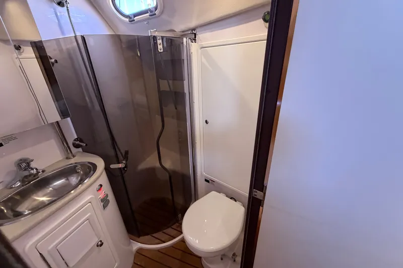 Slide: The Image of Compact bathroom in a 2014 Catalina 445 yacht with shower, sink, and toilet. - 59