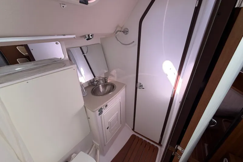 Slide: The Image of Bathroom interior of a 2014 Catalina 445 yacht, featuring sink and mirror. - 49