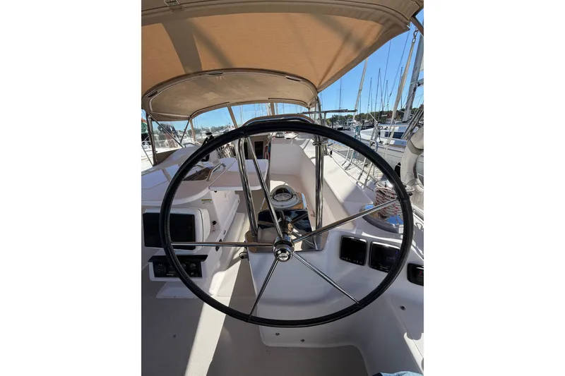 Slide: The Image of Steering wheel of a 2014 Catalina 445 sailboat, docked in a marina. - 22