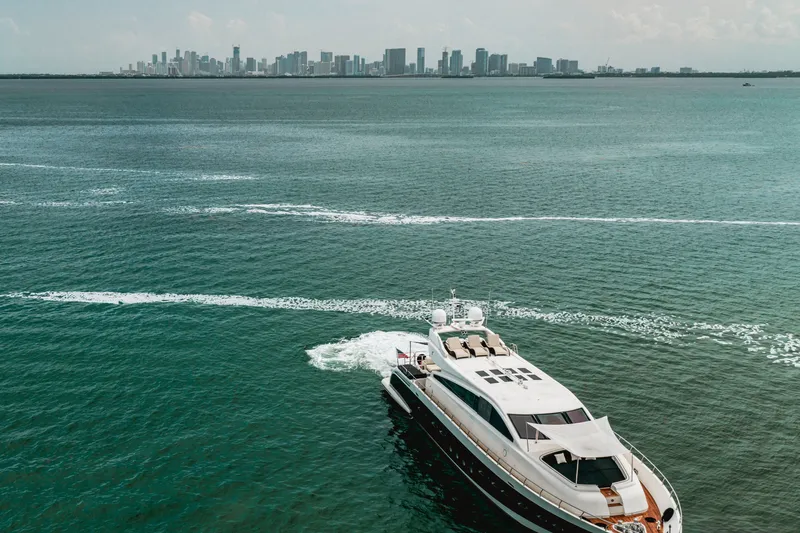 Slide: The Image of Luxury yacht Arno Leopard 31 cruising near city skyline, 2006 model. - 1
