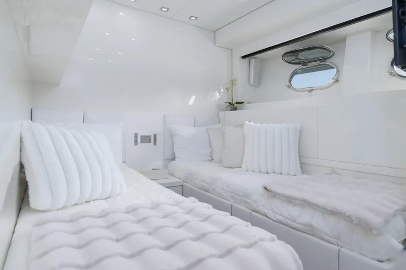 Slide: The Image of Luxurious white interior of 2006 Arno Leopard 31 yacht cabin with plush bedding. - 20