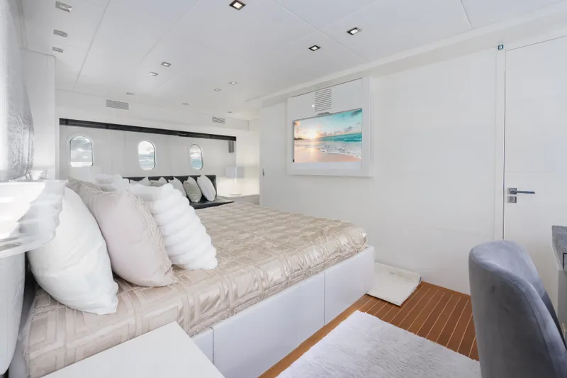 Slide: The Image of Luxurious bedroom interior of 2006 Arno Leopard 31 yacht with modern decor and ocean view. - 19