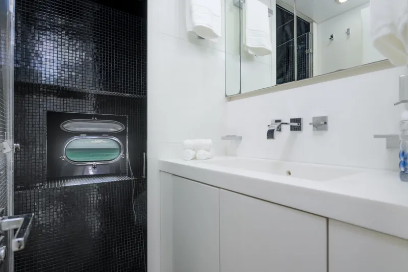 Slide: The Image of Luxurious yacht bathroom with sleek black tiles and modern fixtures, Arno Leopard 31, 2006. - 11