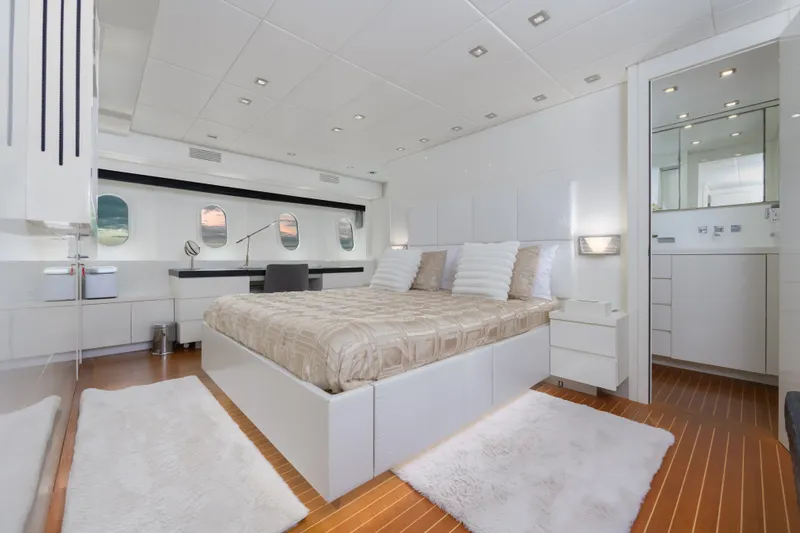 Slide: The Image of Luxurious bedroom interior on 2006 Arno Leopard 31 yacht, featuring modern design and elegant decor. - 13