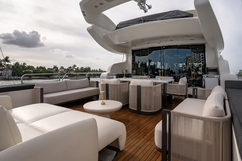 Slide: The Image of Luxurious 2006 Arno Leopard 31 yacht deck with elegant seating and scenic waterfront view. - 6