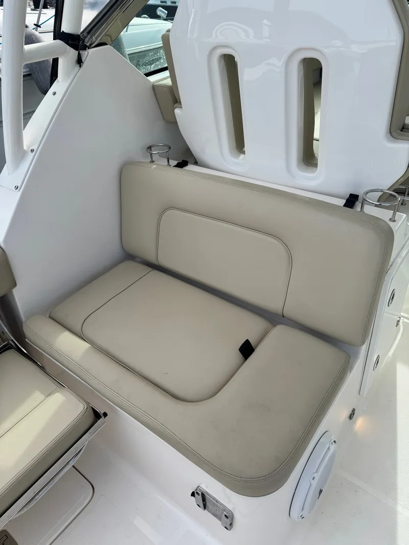 Slide: The Image of Beige seating with backrest and cup holders on a boat. - 18