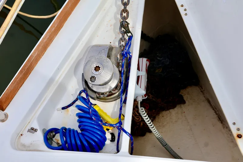 Slide: The Image of Anchor locker with windlass, rope, and chain on a boat. - 25